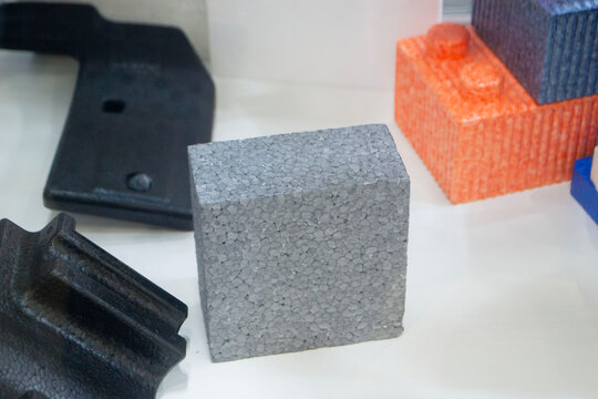 Products made from foamed polymers expanded polypropylene EPP and expanded polystyrene EPS. Model of dense and lightweight material, universal foam. New modern technologies. Industrial manufacturing