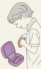Naklejka premium Young person carefully examining a small round object with an open purple case beside them.