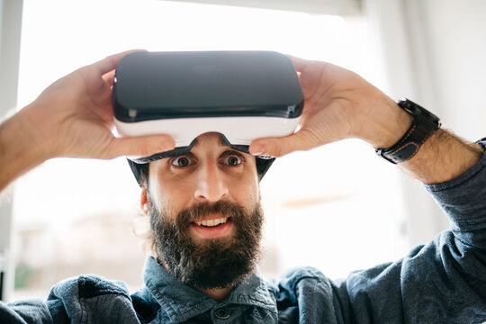 Portrait of starring man with Virtual Reality Glasses
