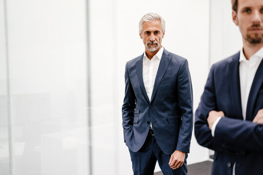 Portrait of two businessmen in office