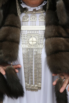Silver jewelry, Jewellery, beads. Closeup photo of jewels, metal necklace. Look, outfit of Yakut woman, girl in traditional national costume, dress, folk style of Russian north. Yakut fashion, detail