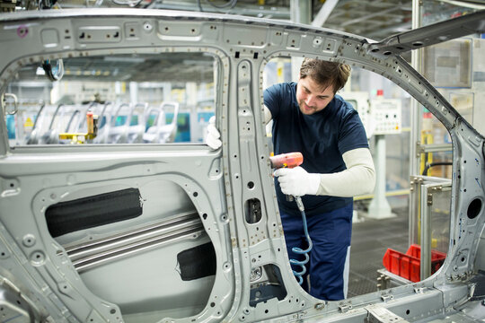 Man working in modern car factory