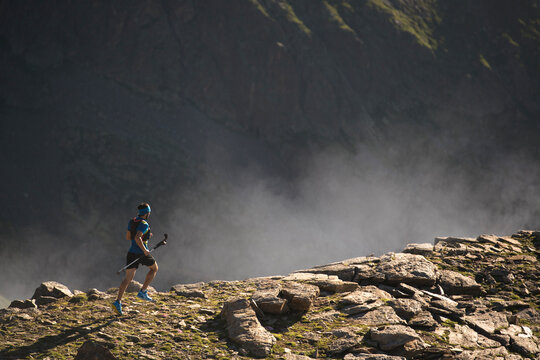 Italy, Alagna, trail runner on the move near Monte Rosa mountain massif