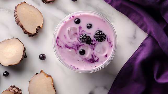 Taro bubble tea in a clear plastic cup with black tapioca pearls, pastel purple drink on a white marble surface
