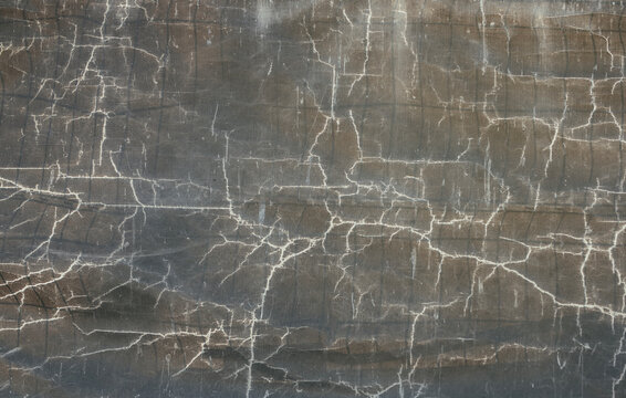 Vintage Cracked Canvas Texture With Weathered Paint and Fine Craquelure Pattern