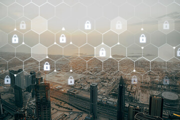 Fototapeta premium View of a city skyline with digital security icons overlaid on a summer afternoon
