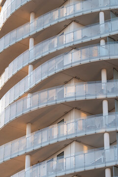 Copenhagen apartment building exterior with modern curved balconies and residential facade architecture highlighting urban housing development and real estate