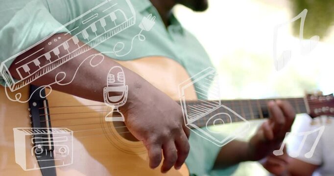 Guitarist strumming at soundhole, starting music doodles, camera pulling back while performing song