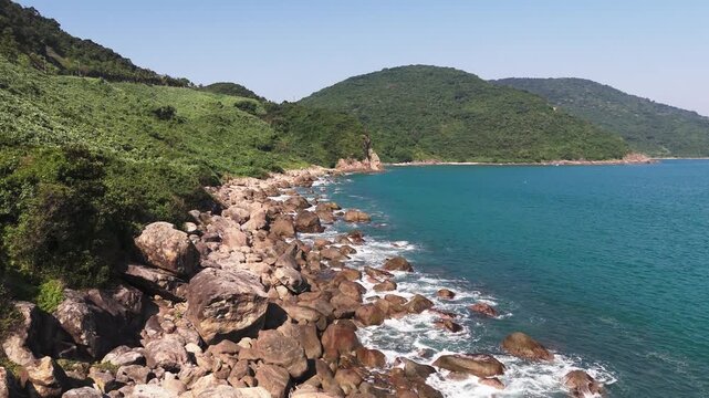 Fly over coastline at rocks at Ban dao son tra in Da Nang