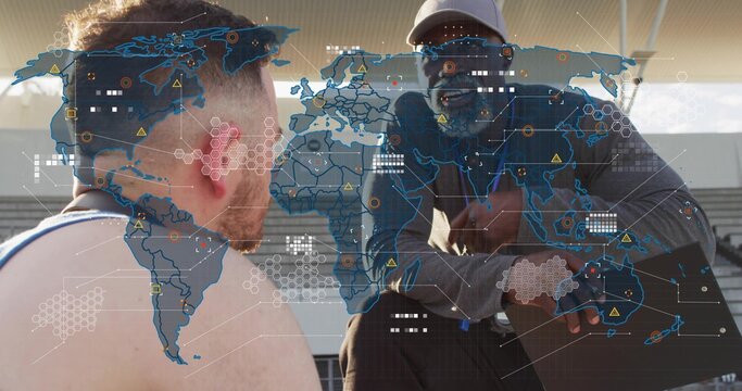 Advising coach in baseball cap and shades, athlete with bare torso listening on stands, map overlay