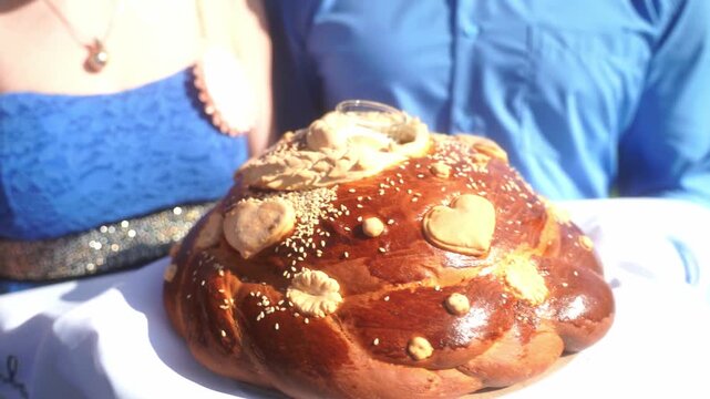 Wedding bread - loaf (cake). Wedding bread. A loaf is decorated with flowers, stables, ears of dough. A wedding tradition. High quality video