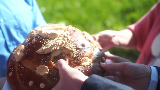 Wedding bread - loaf (cake). Wedding bread. A loaf is decorated with flowers, stables, ears of dough. A wedding tradition. High quality video