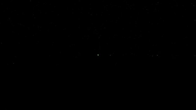 Green abstract energy beams intersecting on a dark background, technology light concept.