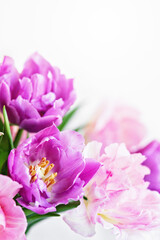 Obraz premium spring greeting background with pink and purple flowers. Romantic spring floral composition perfect for Mothers Day, greeting cards, weddings, and feminine design themes.
