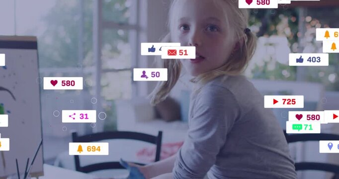 Girl painting, raising blue palms to camera while social media icons growing around hands for likes