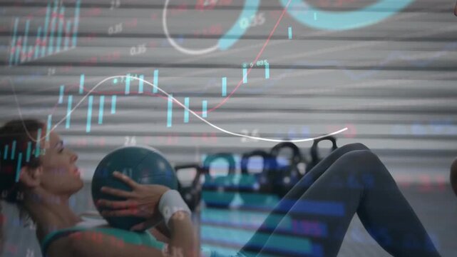 Coach cueing woman crunching blue med ball, rotating for core tone while finance charts overlaying