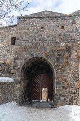 Fototapeta premium The scenic view of Kars, the Castle of Kars (Kars Kalesi) in winter on a snowy day, in Turkey. 
