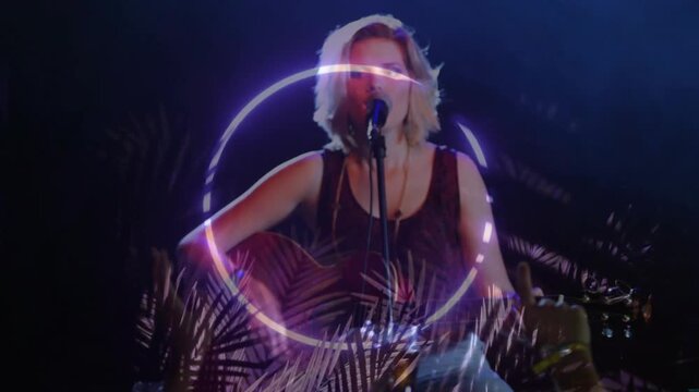 Light cue sparking neon ring, palms layering, singer strumming guitar, singing, centering frame