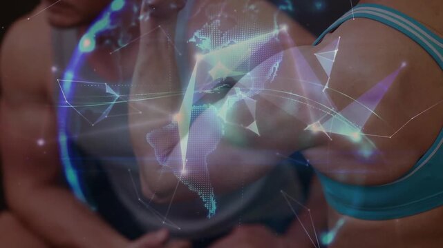 Fitness athlete raising and flexing arm to showcase bicep, hologram nodes forming globe over arms