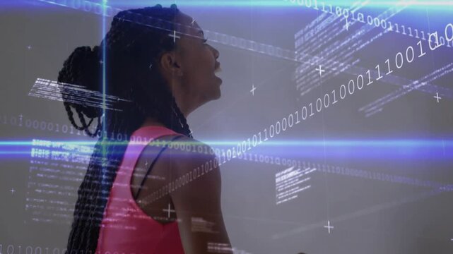 Vertical video: Turning woman in pink tank holding handrail in room, squatting for balance, overlay