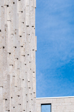 Minimal modern architecture facade in concrete with texture geometry and sky showing clean details and design as an abstract exterior surface with urban calm