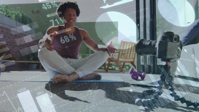 Camera recording coach on yoga mat, speaking to lens, HUD meters floating for fitness