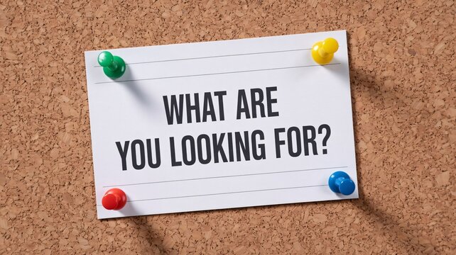 Motivational Card with What Are You Looking For Message on Corkboard