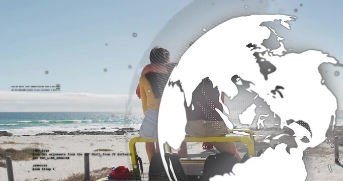 Vertical video: Pointing left in yellow causing couple turning at beach on buggy as globe moving