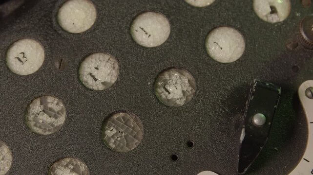 Extreme close-up shot of the old enigma cipher device. Retro machine device attached to a typewriter