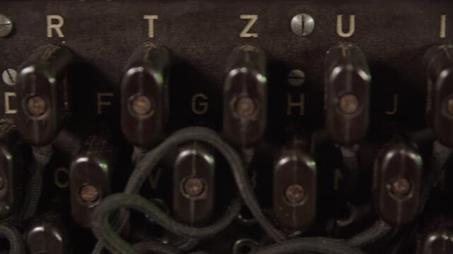 Extreme close-up shot of the buttons of a enigma cipher device. Retro machine device attached to a typewriter