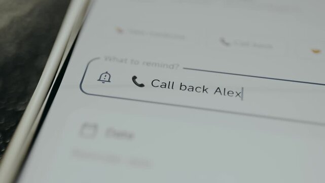 Reminder being set on a phone to Call back Alex