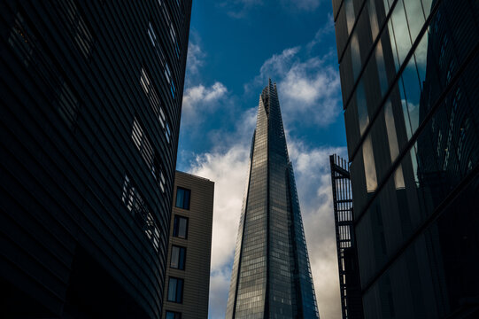The Shard skyscraper in London's financial center with dramatic sky