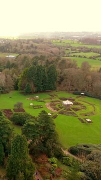 Approaching vertical social ratio 60FPS aerial video of Sir Thomas and Lady Dixon Park in Belfast, Northern Ireland on a sunny day. Produced with Rec709 color.