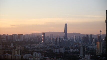 Kuala lumpur skyline illustrating a sprawling city, modern skyscrapers, and urban landscape at sunset, emphasizing economic growth, travel, and malaysian development © NJF
