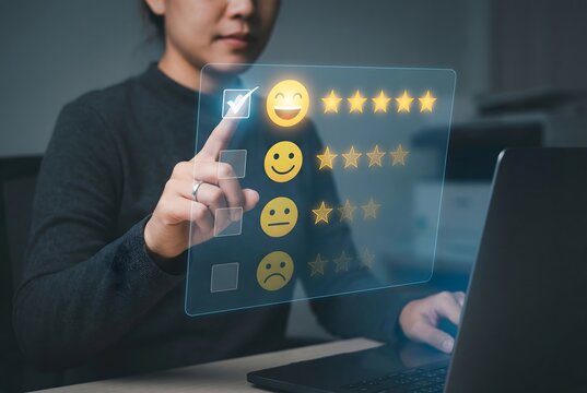 Person selects a high rating on a virtual customer satisfaction survey with smiley faces and stars.