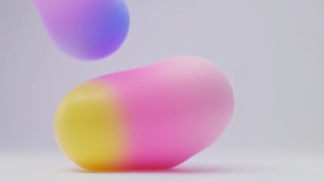 Colorful abstract blobs in shades of blue, pink, and yellow against a soft, light background