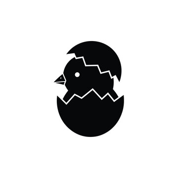 Black silhouette of a newborn chick hatching from an egg