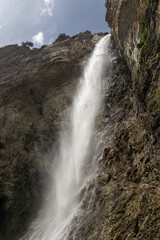 The beautiful 90m high waterfall of Cascade Saint Benoit, near Aussois, Modane, in Savoie, France. The waterfall is a popular tourist spot in the French Alps.