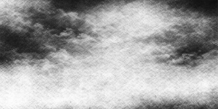 Abstract grunge black and white background with a dark textured cloudscape featuring mist and smoke for a dramatic storm design