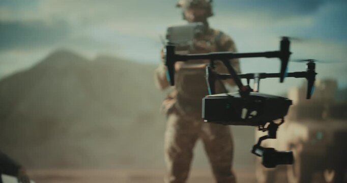 Male Special Operations Soldiers Launch Tactical Quadcopter Drone at a Desert Base, Battlefield Surveillance, Target Strike, Force Protection, Reconnaissance During a High-tech Military War Mission