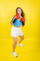 Woman boxer standing in a determined fighting stance