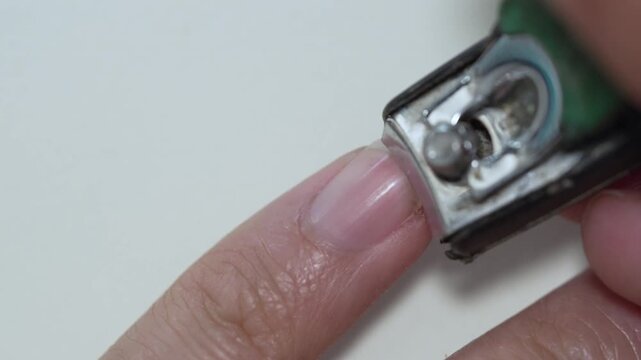 Macro Shot Close Up of Pinky Finger Nail Being Clipped