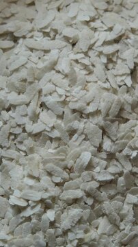 Close-up of white flattened rice flakes