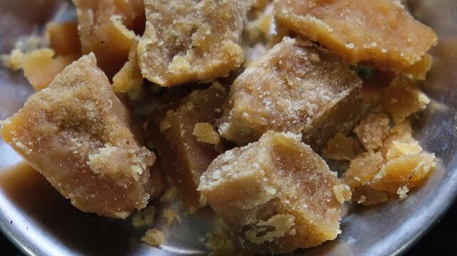 Pieces of raw organic jaggery in a bowl