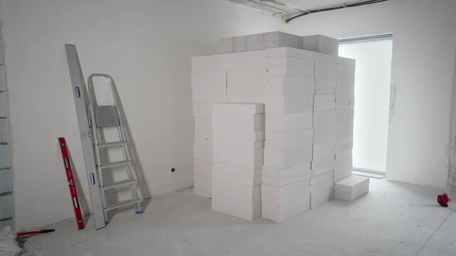 Closeup of stacked white lightweight concrete blocks with a rough texture for building