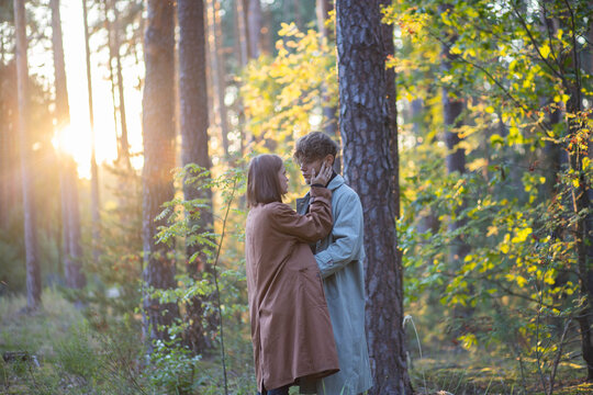 A couple in love on a date in the forest, a relationship crisis and emotional dependence