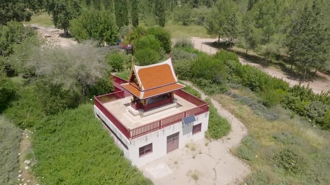 Aerial view of the Thai Pagoda in Ben Shemen Forest, Israel, surrounded by lush green pine and cypress trees