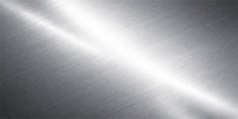 A polished stainless steel plate creates an industrial brushed metal background with a smooth silver texture and shiny light gray reflections on a metallic aluminium surface pattern