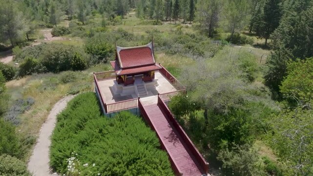 Aerial view of the Thai Pagoda in Ben Shemen Forest, Israel, surrounded by lush green pine and cypress trees