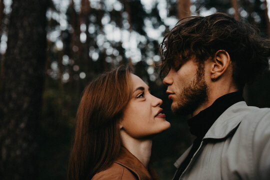 A couple in love on a date in the forest, a relationship crisis and emotional dependence